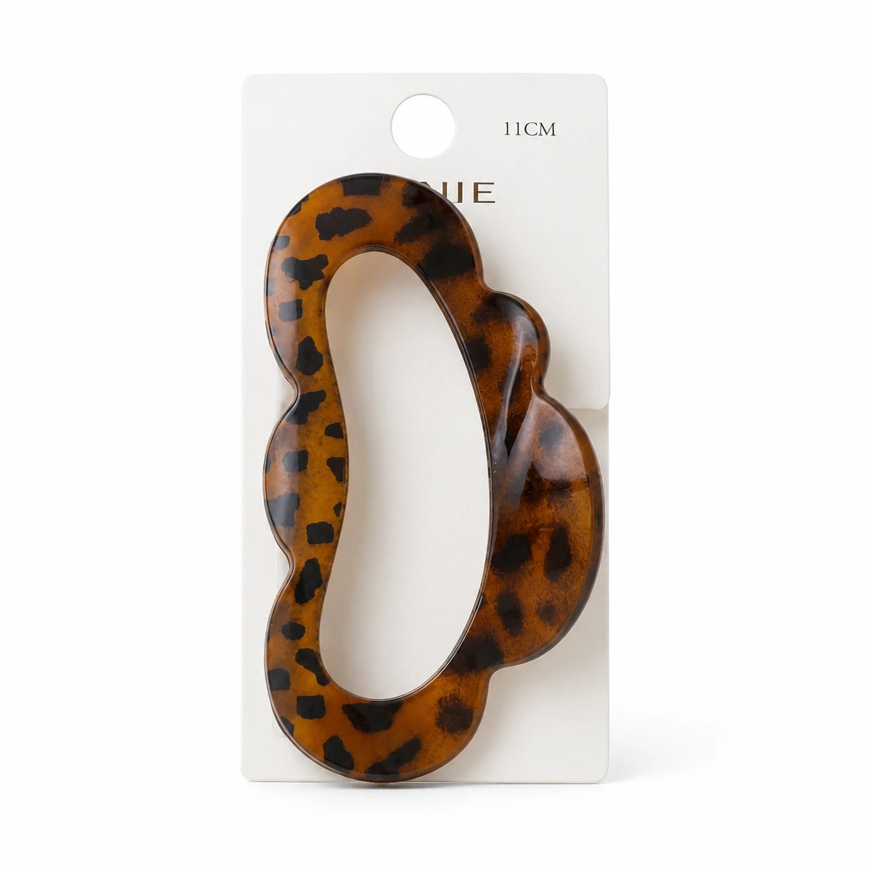 Pinza de pelo leopardo de 11 cm sobre tarjeta blanca